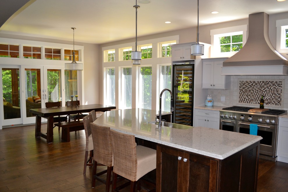 Inspiration for a large arts and crafts kitchen/dining combo in Milwaukee with beige walls, dark hardwood floors and no fireplace.
