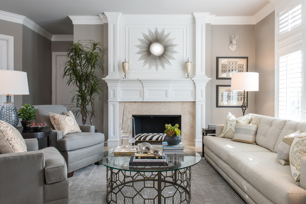 This is an example of a mid-sized traditional formal open concept living room in Dallas with grey walls, a standard fireplace, a stone fireplace surround and no tv.