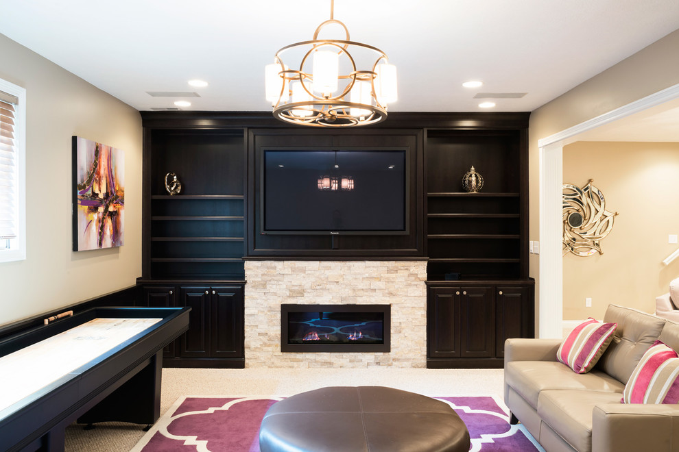 This is an example of a mid-sized contemporary look-out basement in Indianapolis with beige walls, carpet, a ribbon fireplace and a stone fireplace surround.