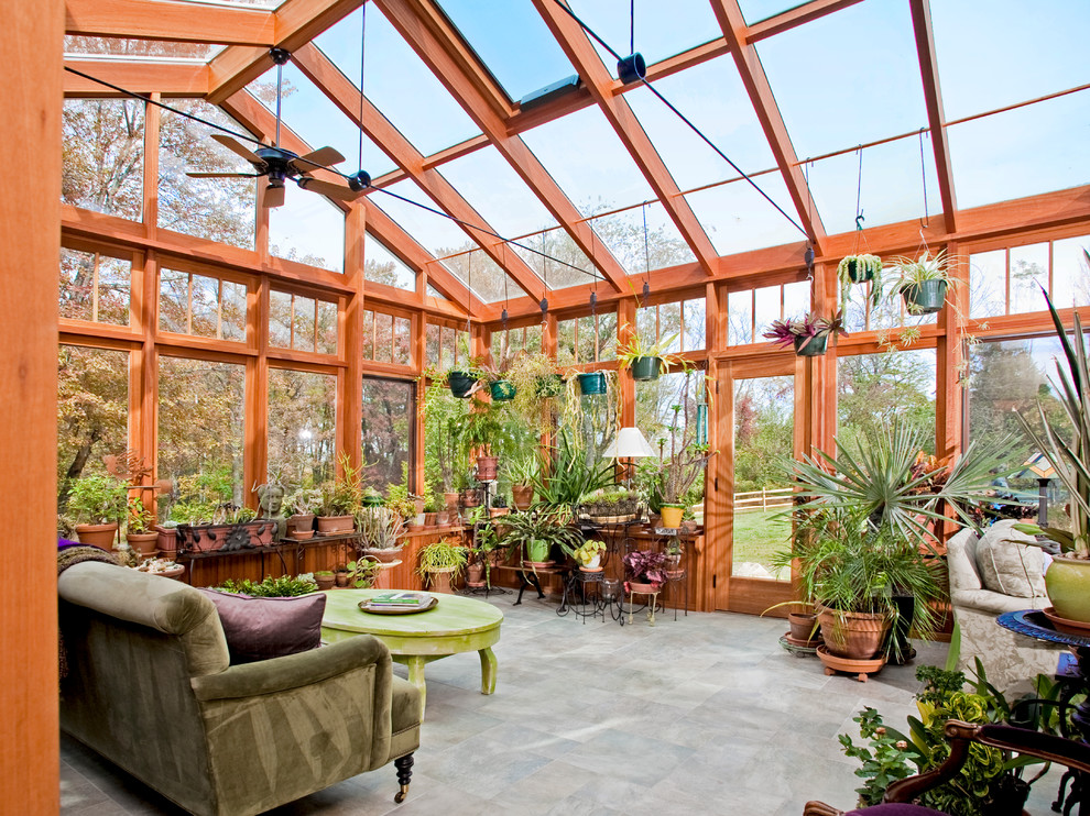 Photo of a large traditional sunroom in Philadelphia with travertine floors, no fireplace and a glass ceiling.