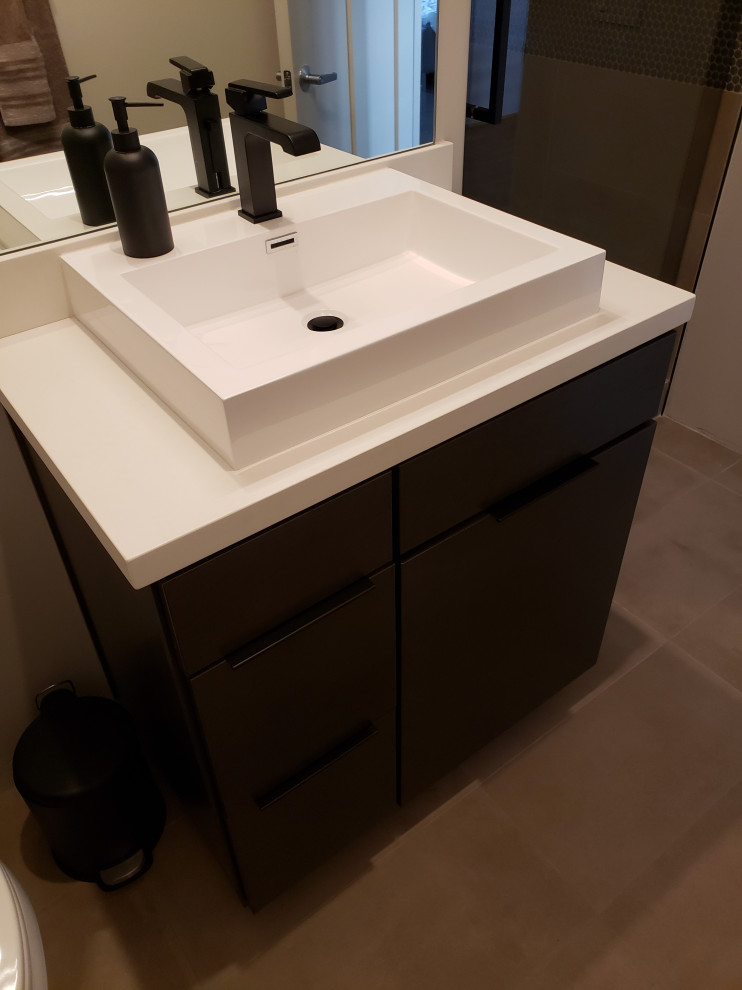 Example of a transitional bathroom design in Phoenix with flat-panel cabinets and light wood cabinets