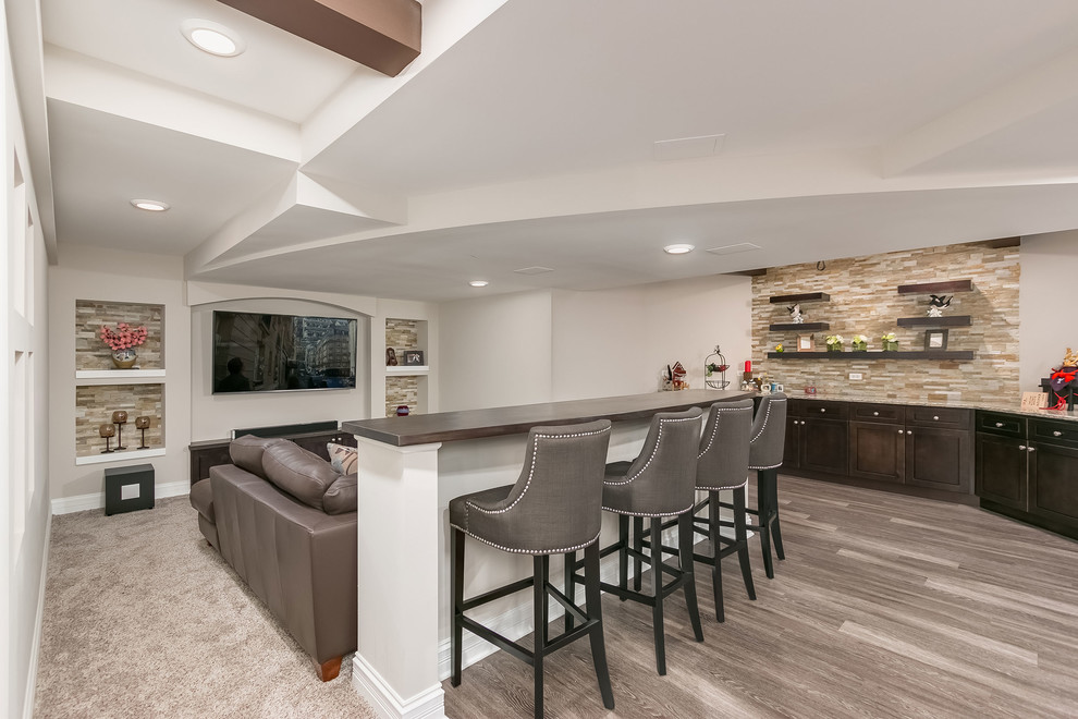 Design ideas for a large transitional fully buried basement in Chicago with white walls, vinyl floors, no fireplace and brown floor.