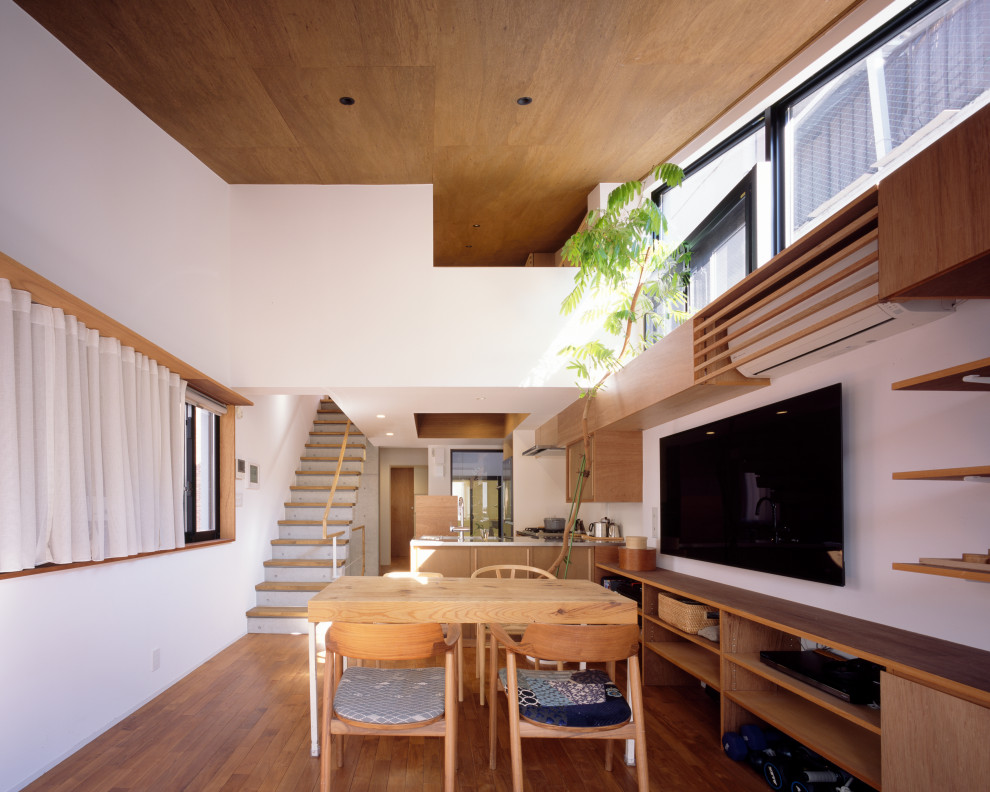 Inspiration for a mid-sized modern medium tone wood floor, brown floor, wood ceiling and shiplap wall great room remodel in Tokyo with white walls and no fireplace