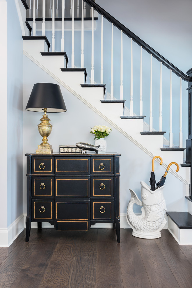 Mid-sized elegant dark wood floor and brown floor foyer photo in Boston with blue walls