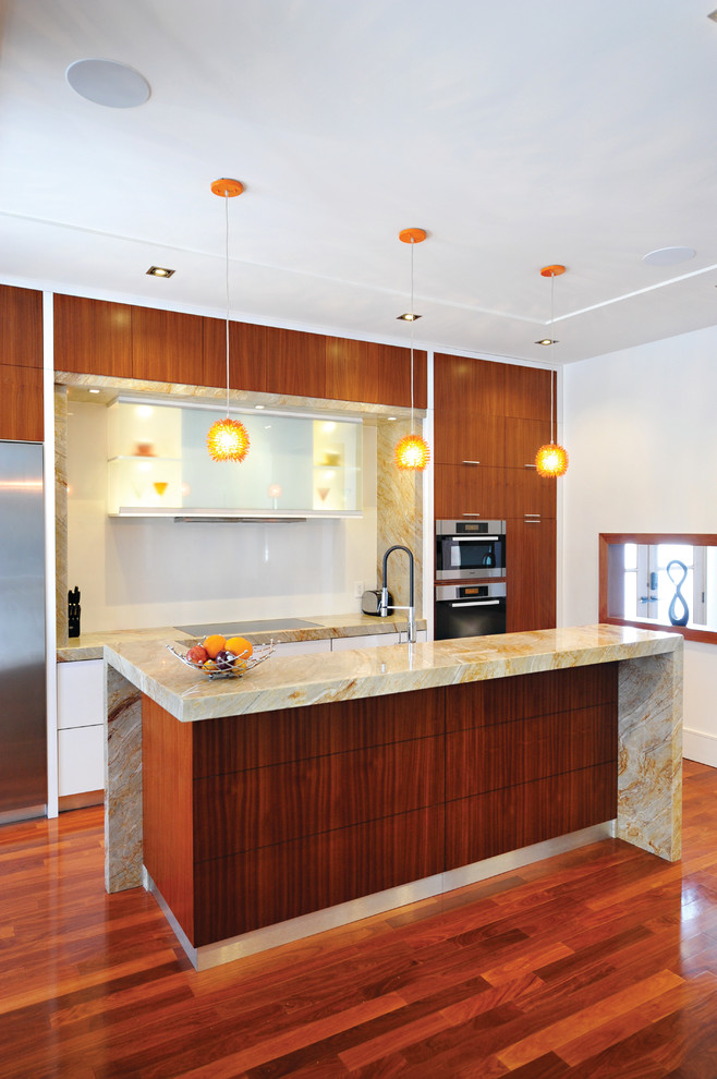 Eat-in kitchen - mid-sized transitional single-wall medium tone wood floor eat-in kitchen idea in Toronto with a double-bowl sink, flat-panel cabinets, medium tone wood cabinets, granite countertops, multicolored backsplash, stone slab backsplash, stainless steel appliances and an island
