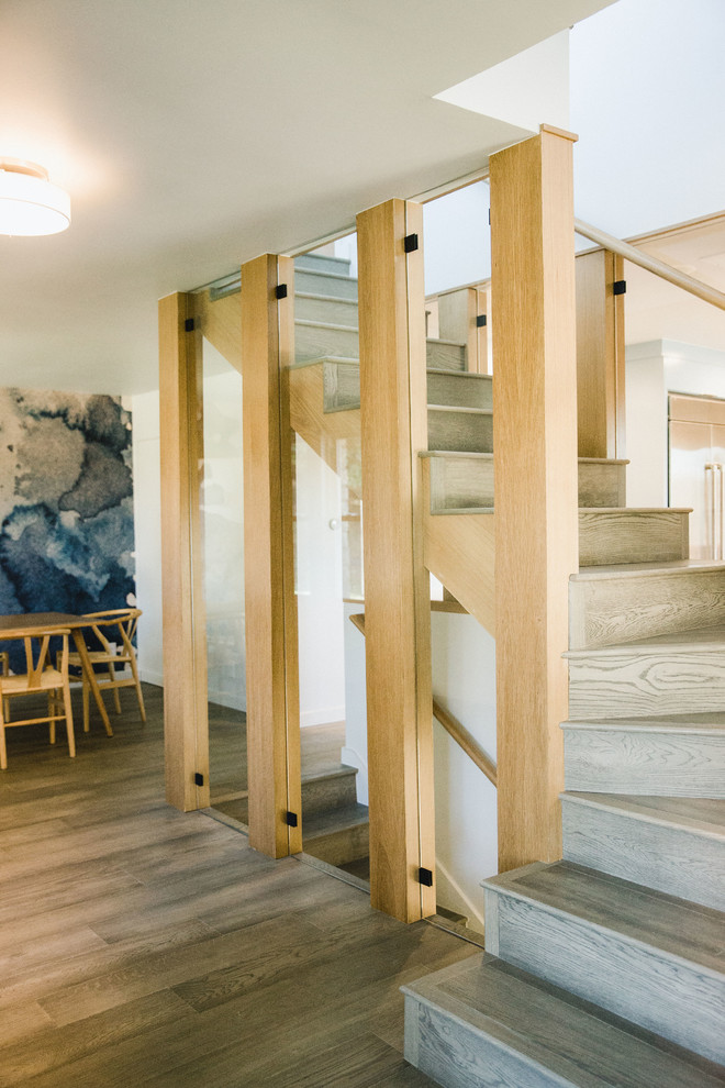 Mid-sized midcentury wood l-shaped staircase in Austin with wood risers and wood railing.