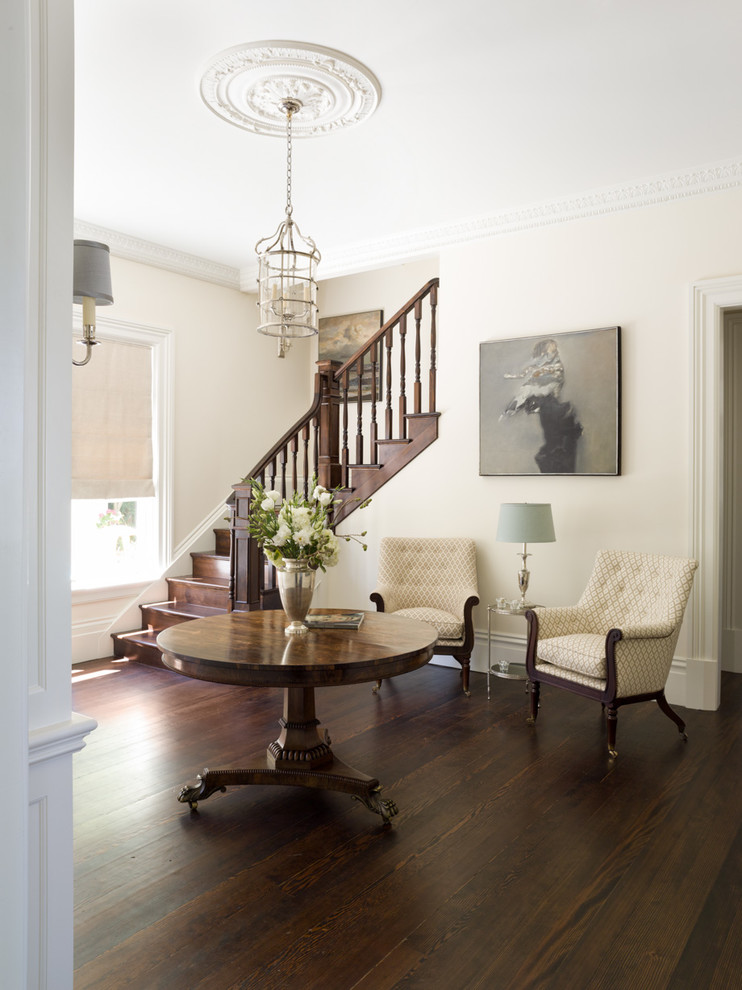 Traditional hallway in San Francisco with white walls and dark hardwood floors.