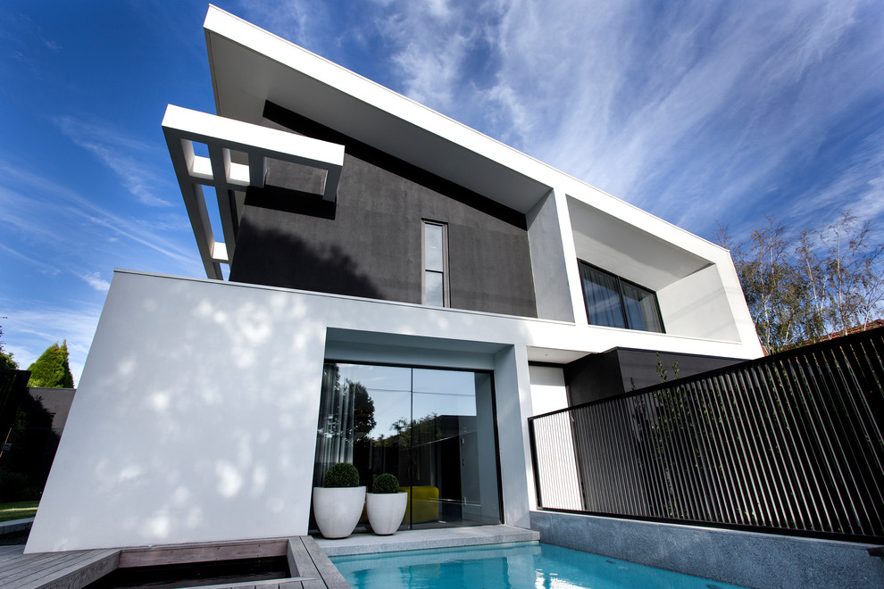 Design ideas for a contemporary two-storey black house exterior in Melbourne.