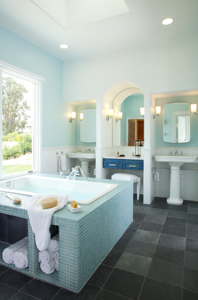 This is an example of a contemporary bathroom in San Luis Obispo with mosaic tile, a pedestal sink and blue tile.