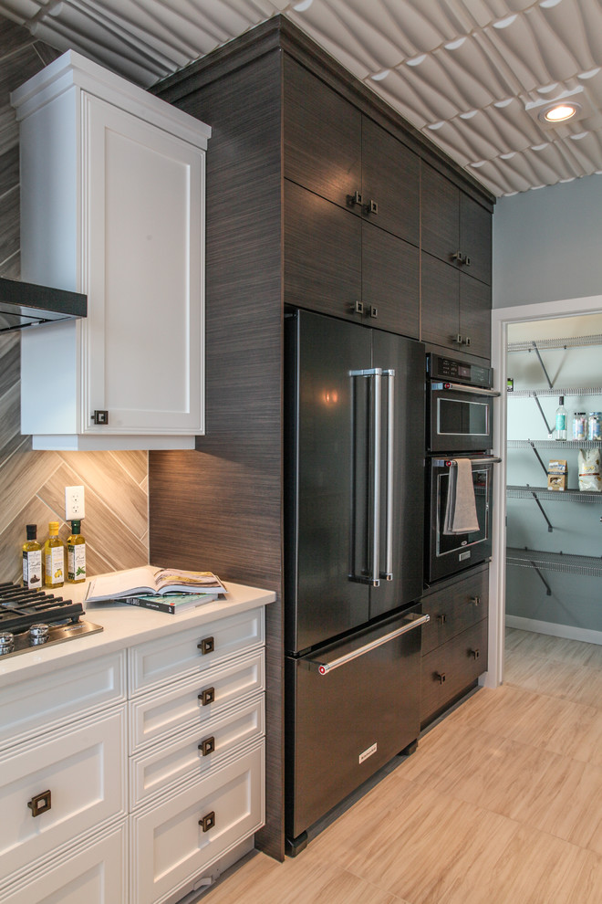 Inspiration for a mid-sized transitional u-shaped open plan kitchen in Calgary with a drop-in sink, flat-panel cabinets, grey splashback, stainless steel appliances and with island.