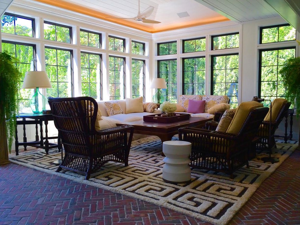 Photo of a traditional sunroom in Orlando with brick floors.