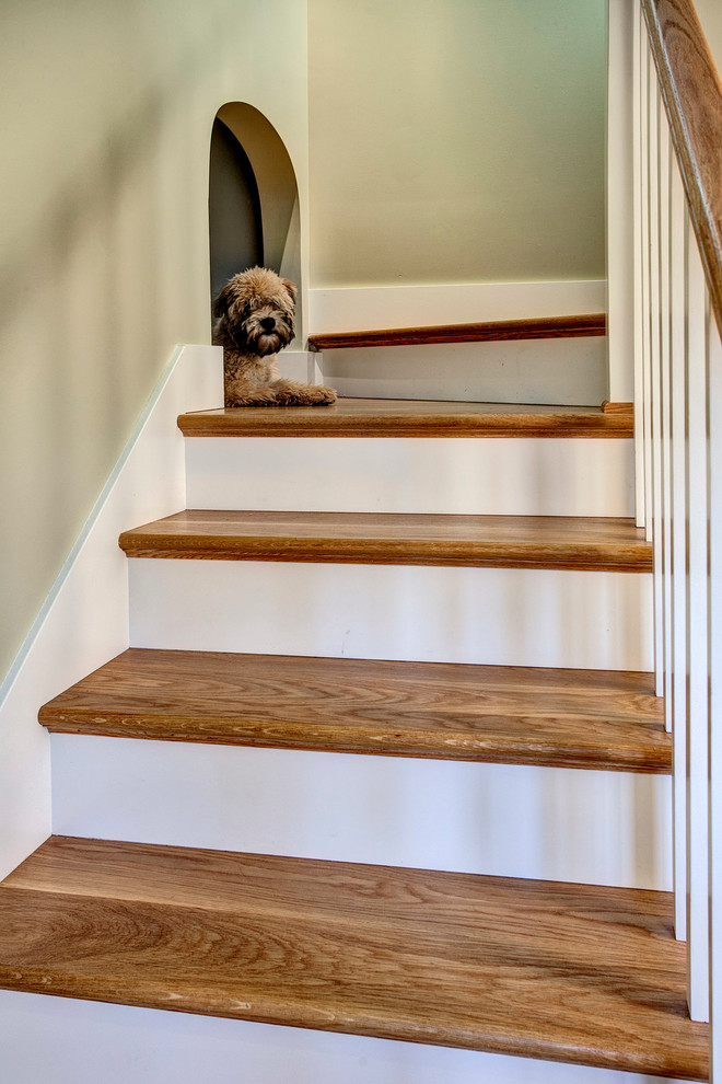 Inspiration for a craftsman wooden staircase remodel in Seattle with painted risers