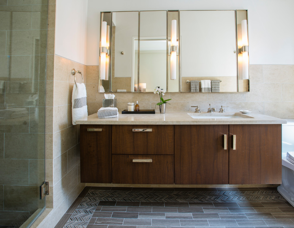 Inspiration for a mid-sized contemporary master bathroom in New York with flat-panel cabinets, dark wood cabinets, a drop-in tub, a corner shower, beige tile, travertine, white walls, cement tiles, an undermount sink, quartzite benchtops, grey floor and a hinged shower door.