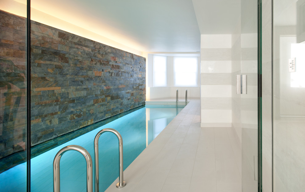 Design ideas for a contemporary indoor rectangular pool in London with tile.