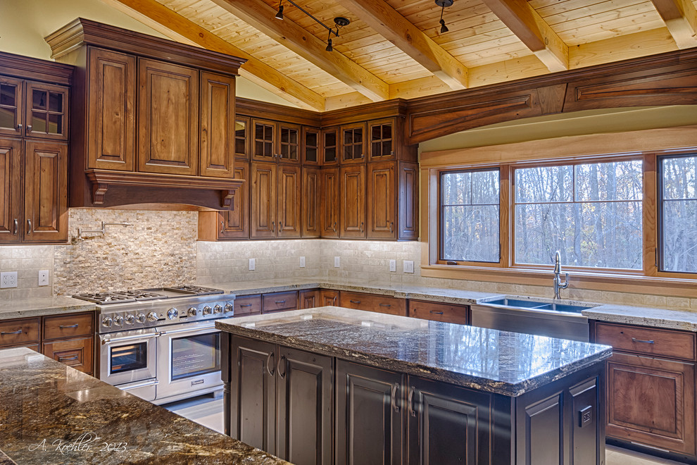 This is an example of a large country u-shaped eat-in kitchen in Baltimore with a farmhouse sink, granite benchtops, stainless steel appliances, raised-panel cabinets, dark wood cabinets, beige splashback, ceramic splashback, ceramic floors, with island and beige floor.