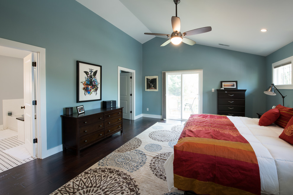Photo of a large arts and crafts master bedroom in Indianapolis with blue walls, dark hardwood floors and no fireplace.