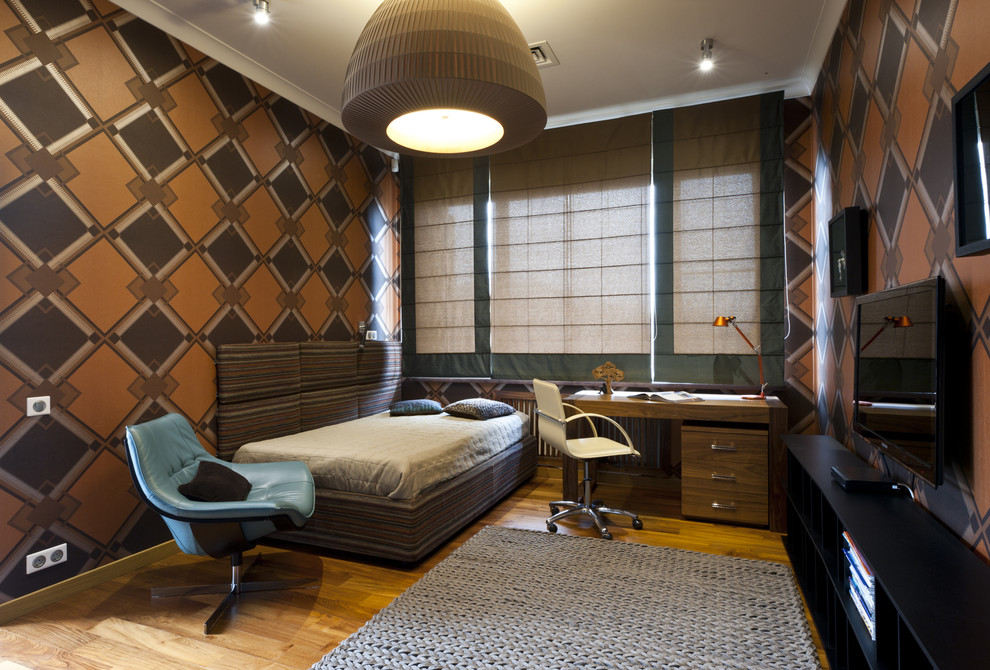 Inspiration for a contemporary teen room for boys in Moscow with brown walls and medium hardwood floors.