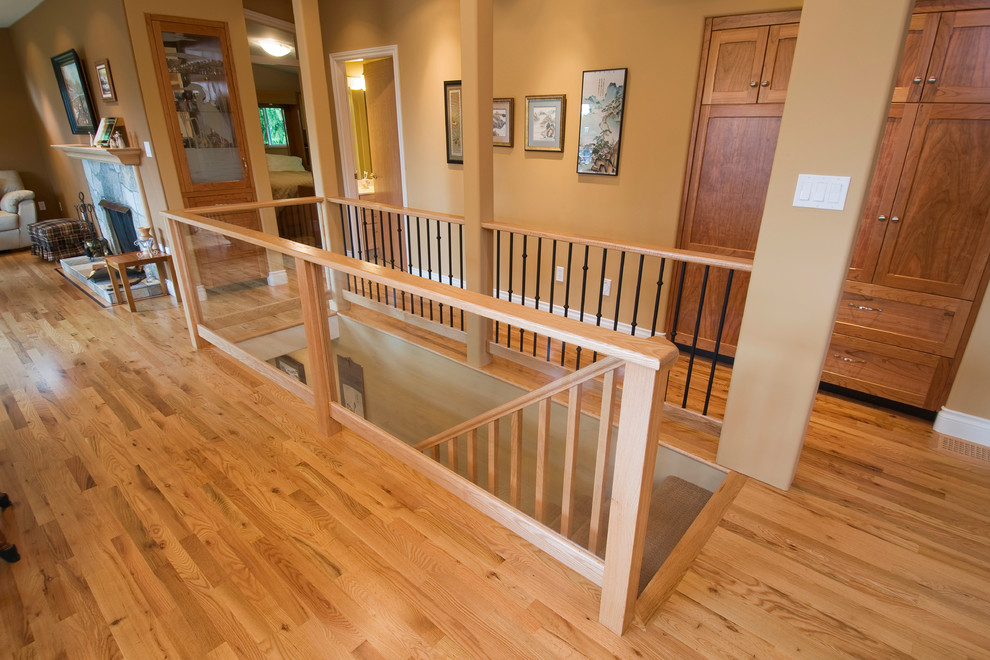Photo of a mid-sized contemporary carpeted straight staircase in Vancouver with carpet risers.