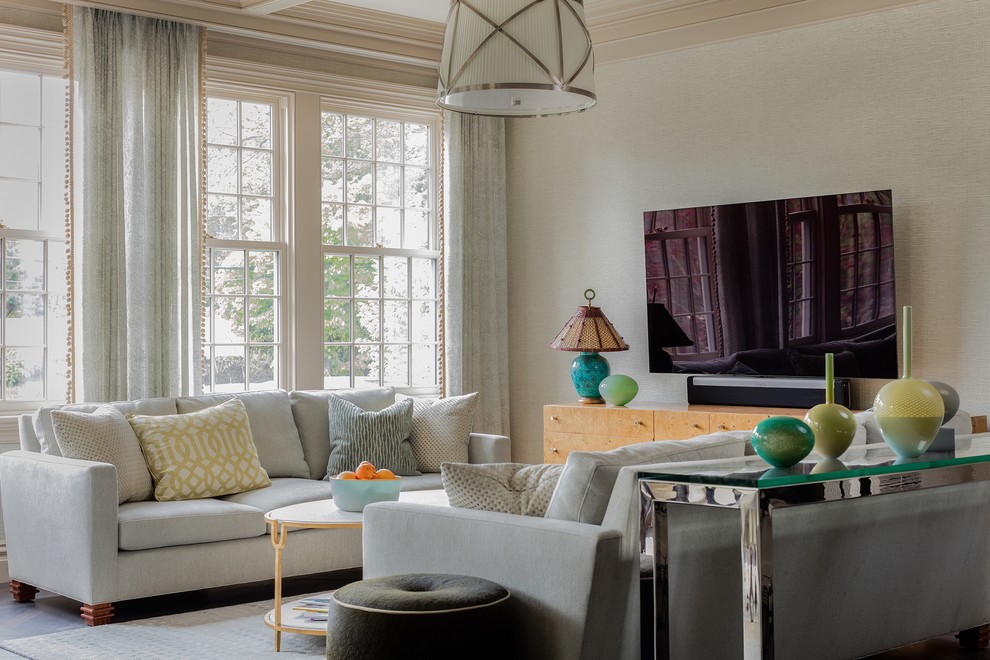 Inspiration for a traditional living room in Boston with beige walls and a wall-mounted tv.