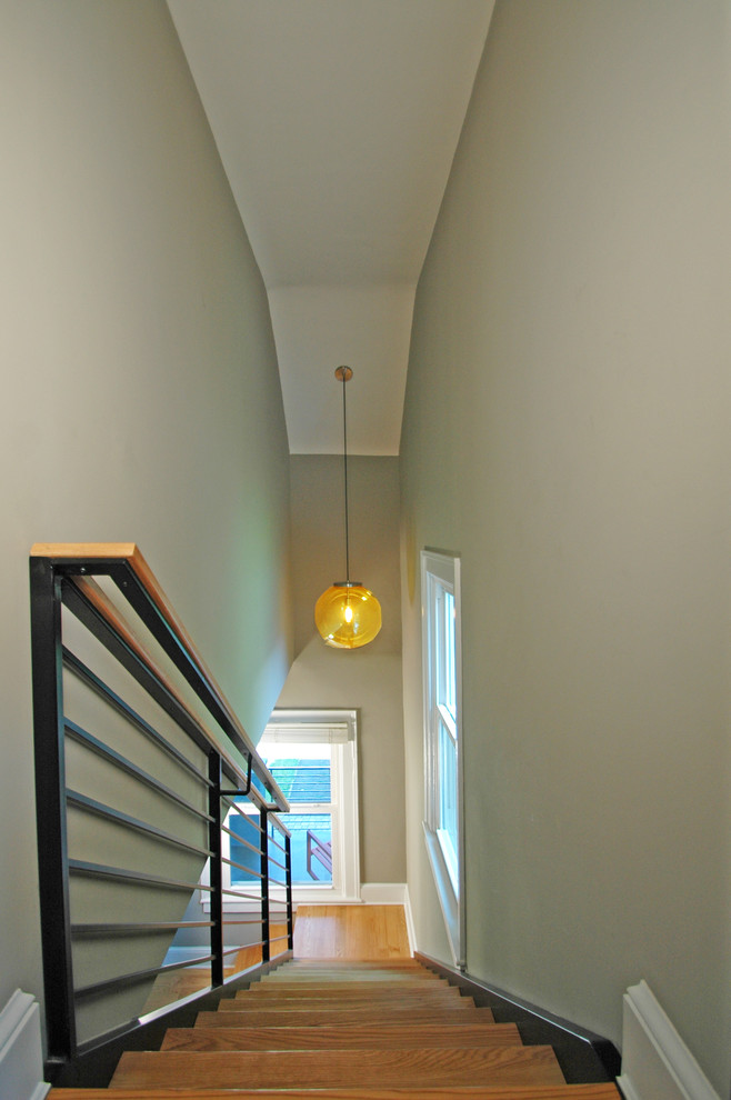 Mid-sized contemporary wood l-shaped staircase in DC Metro with metal risers.
