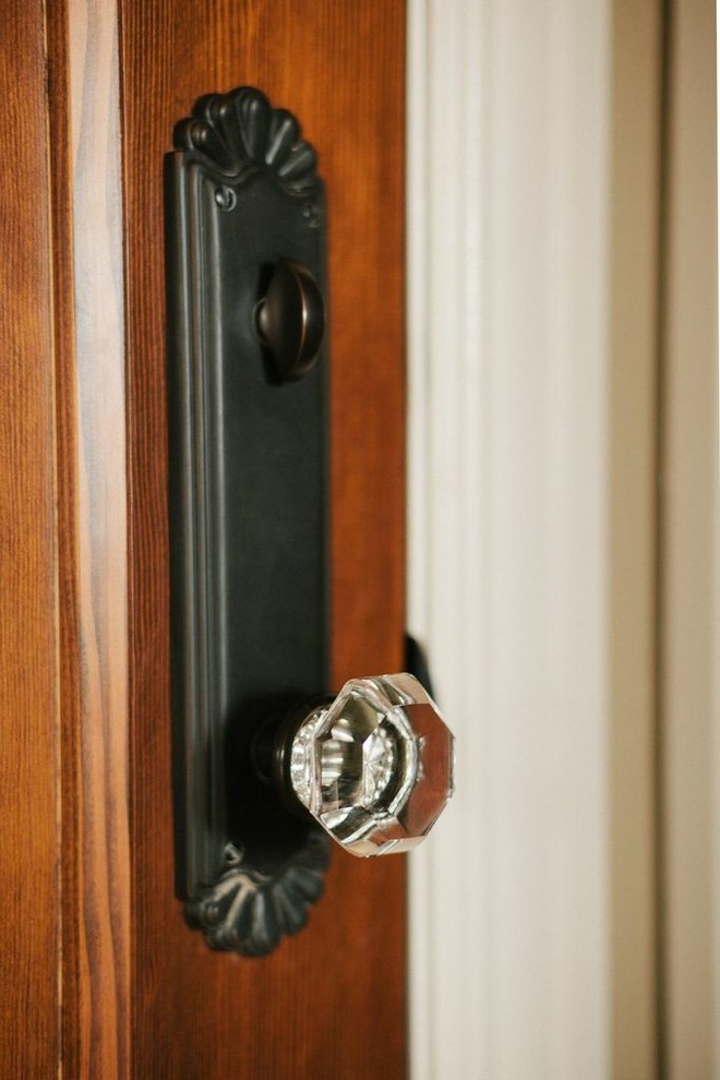 Inspiration for a mid-sized timeless entry hall remodel with beige walls and a medium wood front door