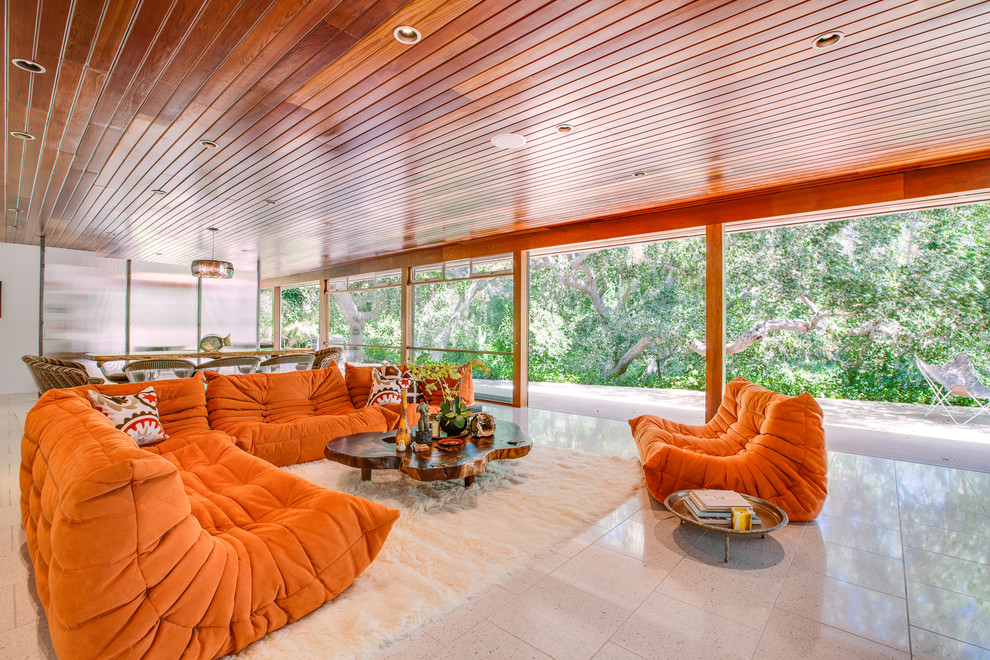 Photo of a midcentury open concept living room in Los Angeles.