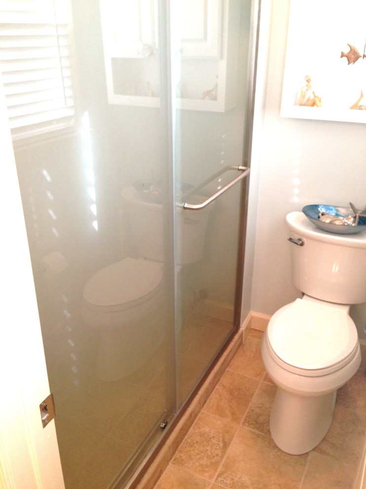 Mid-sized transitional master beige tile and porcelain tile porcelain tile alcove shower photo with raised-panel cabinets, white cabinets, a two-piece toilet and blue walls
