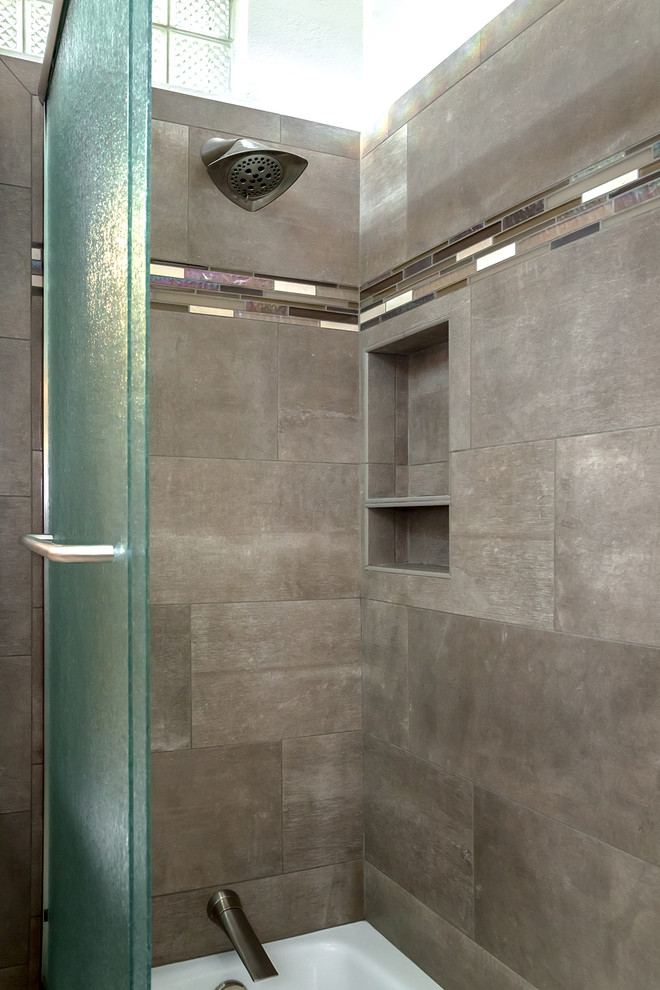 Corner bathtub - large transitional master brown tile and porcelain tile porcelain tile and beige floor corner bathtub idea in Phoenix with recessed-panel cabinets, medium tone wood cabinets, a one-piece toilet, beige walls, an undermount sink and quartz countertops