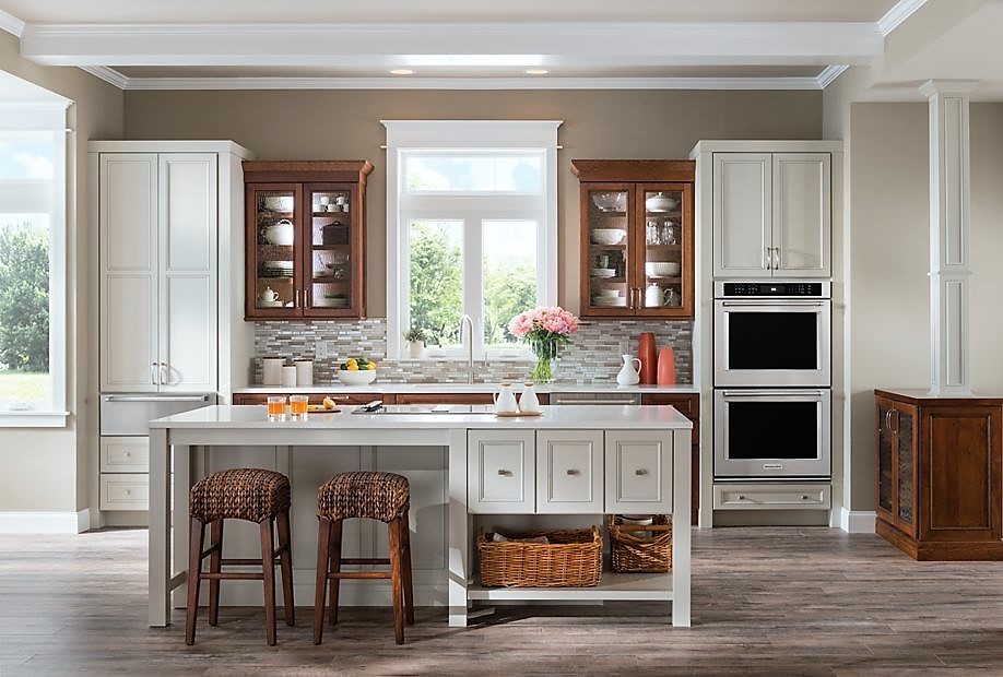Design ideas for a mid-sized transitional galley eat-in kitchen in Other with an undermount sink, recessed-panel cabinets, white cabinets, granite benchtops, grey splashback, mosaic tile splashback, stainless steel appliances, ceramic floors and with island.