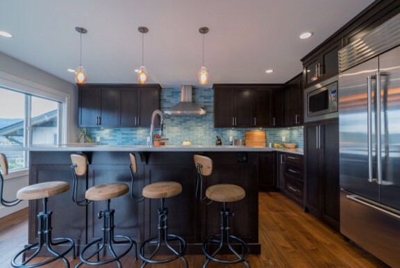 Example of a transitional kitchen design in Vancouver with blue backsplash and glass tile backsplash