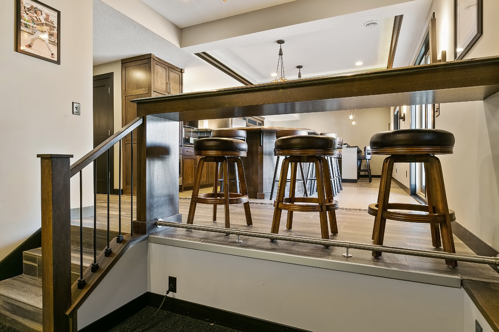 Example of a transitional ceramic tile basement design in Minneapolis