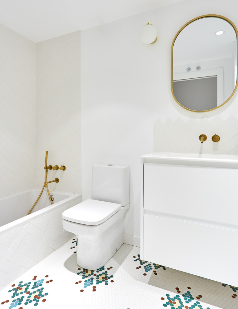 Design ideas for a mid-sized transitional bathroom in Madrid with flat-panel cabinets, white cabinets, a drop-in tub, a shower/bathtub combo, a one-piece toilet, multi-coloured tile, mosaic tile, white walls, mosaic tile floors, a trough sink, multi-coloured floor, an open shower, white benchtops, a single vanity and a built-in vanity.