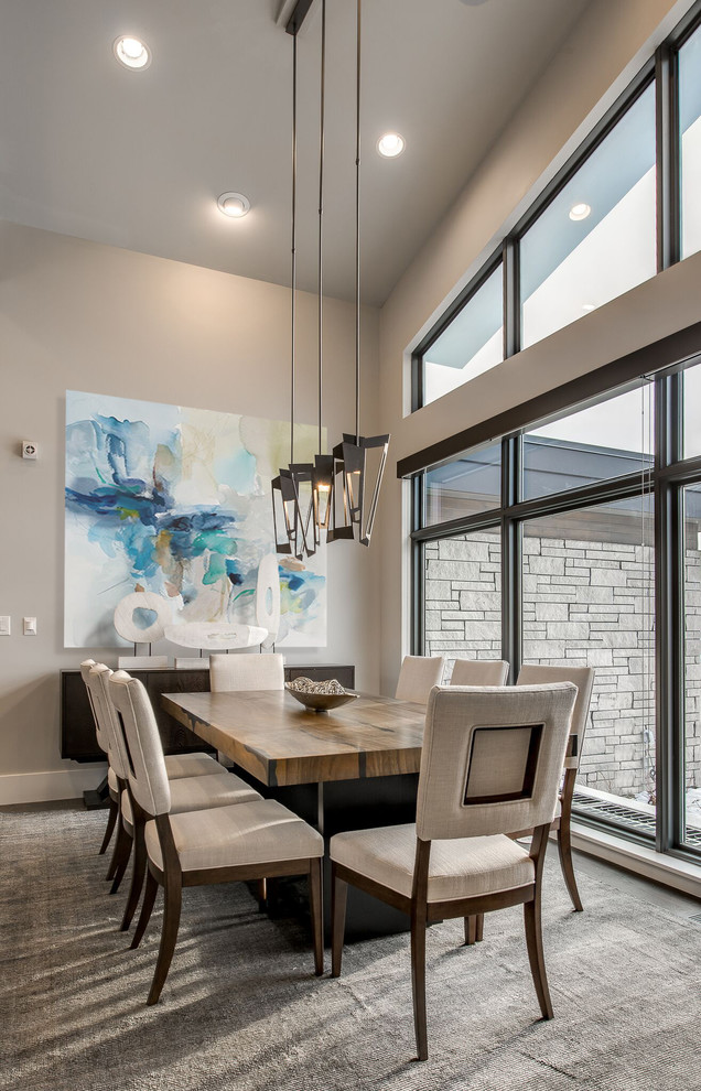 Large contemporary dining room in Denver with grey walls.