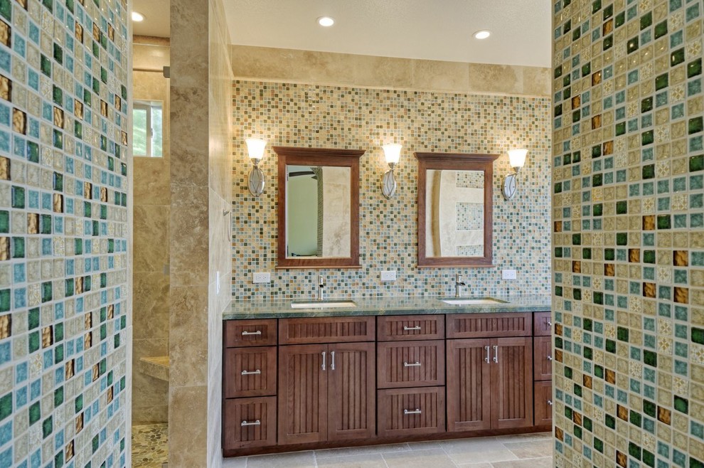 Inspiration for a mid-sized contemporary master bathroom in San Diego with an undermount sink, beaded inset cabinets, dark wood cabinets, granite benchtops, a freestanding tub, an alcove shower, a one-piece toilet, beige tile, stone tile, beige walls and travertine floors.