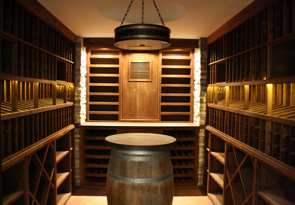 This is an example of a mid-sized arts and crafts wine cellar in Los Angeles with brick floors and storage racks.