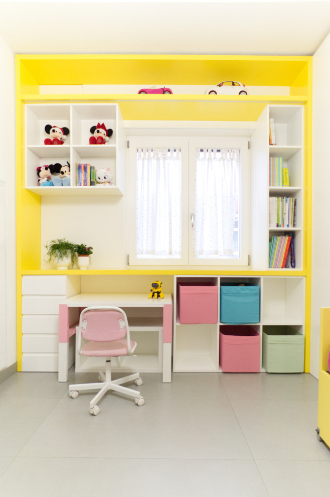 This is an example of a small contemporary kids' bedroom for kids 4-10 years old and girls in Naples with white walls, porcelain floors, grey floor, decorative wall panelling and recessed.