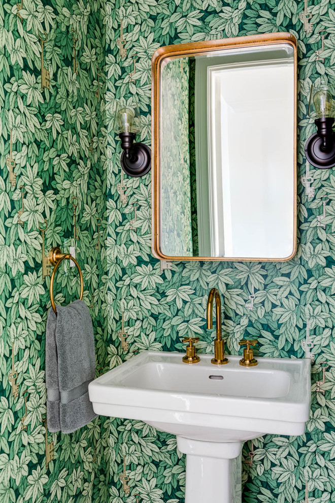 Photo of a transitional powder room in Boston with a pedestal sink and green walls.