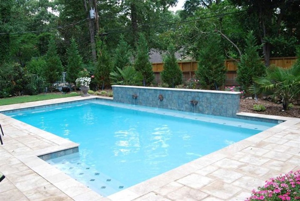 Hot tub - mid-sized backyard stone and rectangular natural hot tub idea