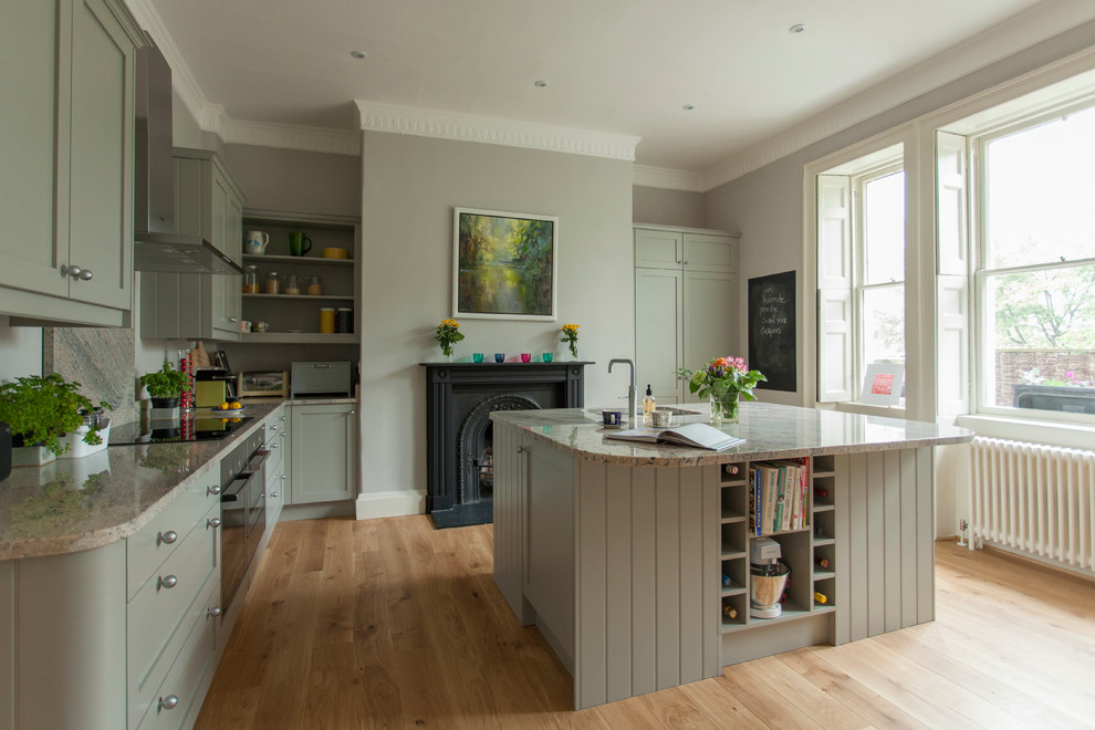 Design ideas for a traditional eat-in kitchen in Other with an undermount sink, shaker cabinets, grey cabinets, granite benchtops, stone slab splashback, stainless steel appliances, medium hardwood floors and with island.