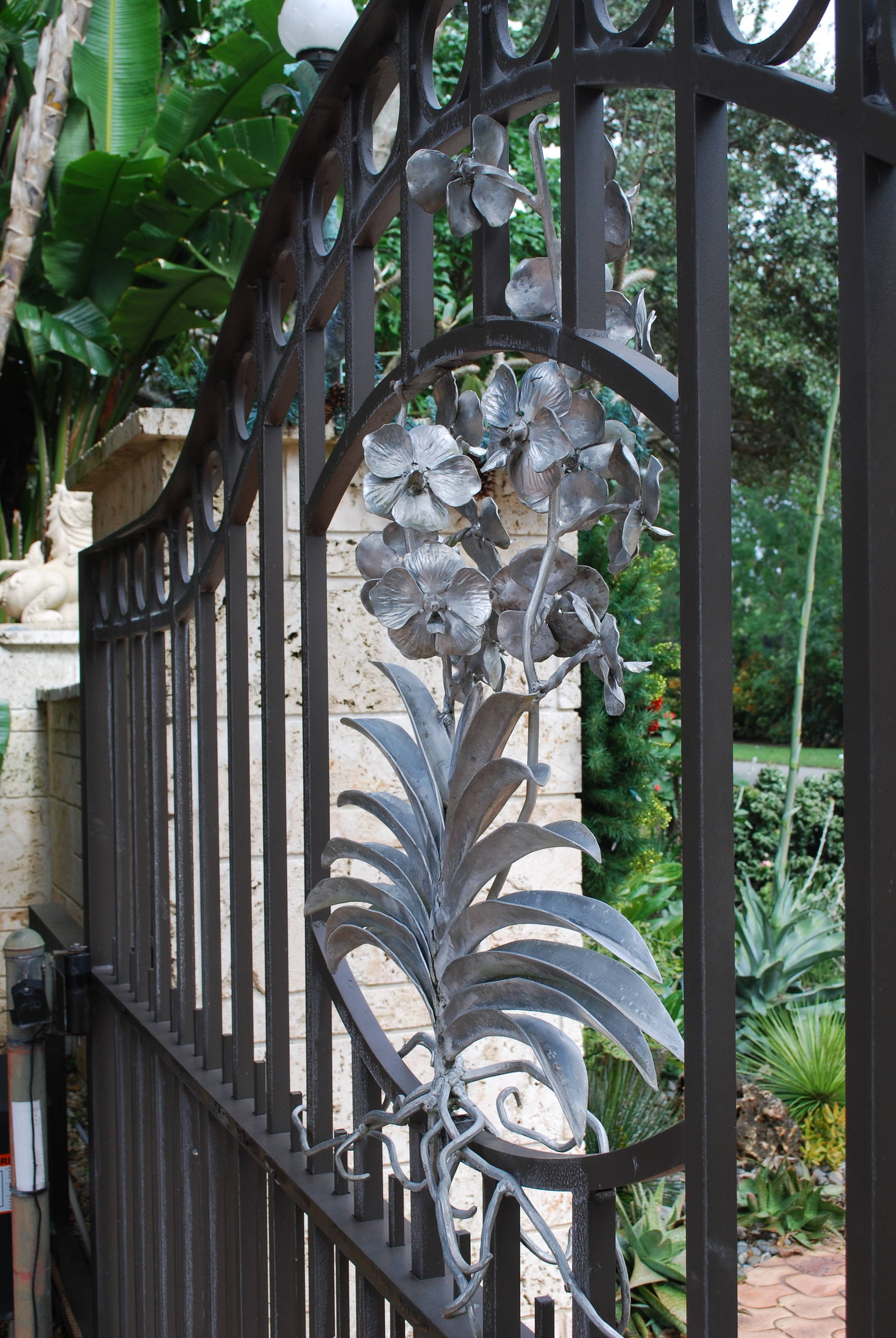 A vanda sculpture adorns the front gate