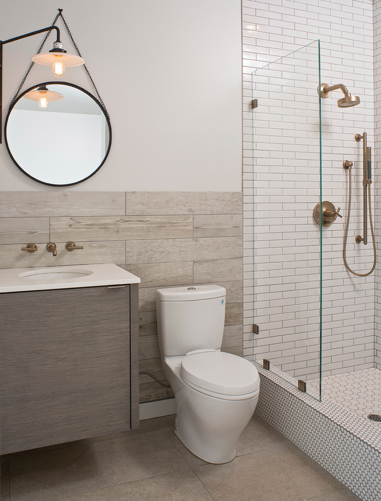 Inspiration for a contemporary 3/4 bathroom in Other with an undermount sink, flat-panel cabinets, an alcove shower, a two-piece toilet, white tile, subway tile and white walls.