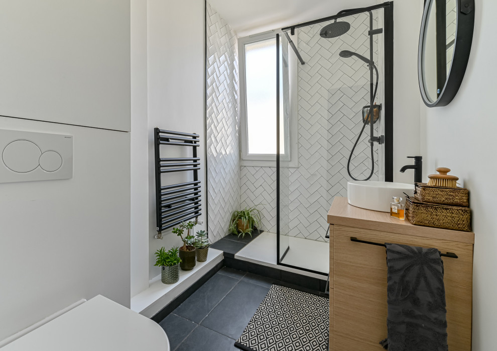 Inspiration for a small contemporary 3/4 bathroom in Paris with beaded inset cabinets, light wood cabinets, a curbless shower, a wall-mount toilet, white tile, terra-cotta tile, white walls, terra-cotta floors, a wall-mount sink, grey floor, a single vanity and a floating vanity.