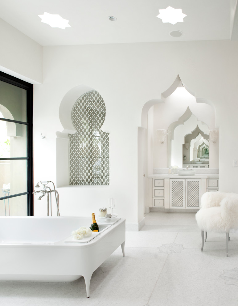 Design ideas for a mediterranean bathroom in Other with a freestanding tub.