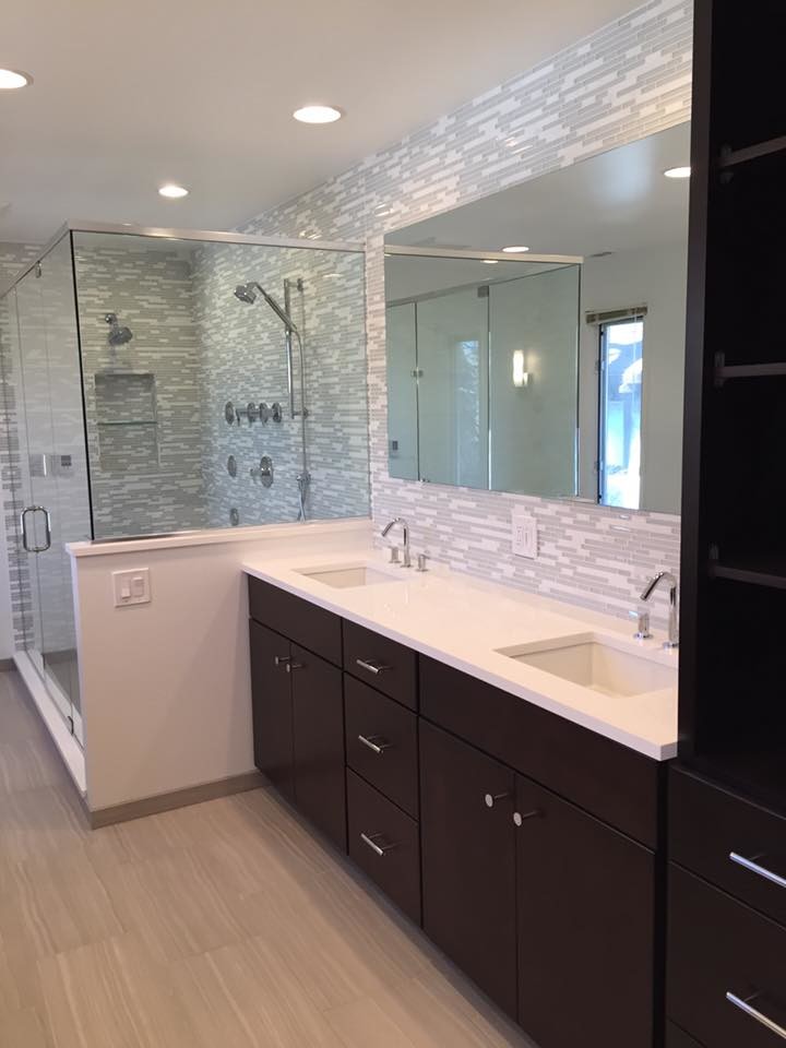 Inspiration for a large contemporary master bathroom in Chicago with flat-panel cabinets, dark wood cabinets, an alcove shower, gray tile, white tile, glass tile, grey walls, porcelain floors, an undermount sink, quartzite benchtops, beige floor and a hinged shower door.