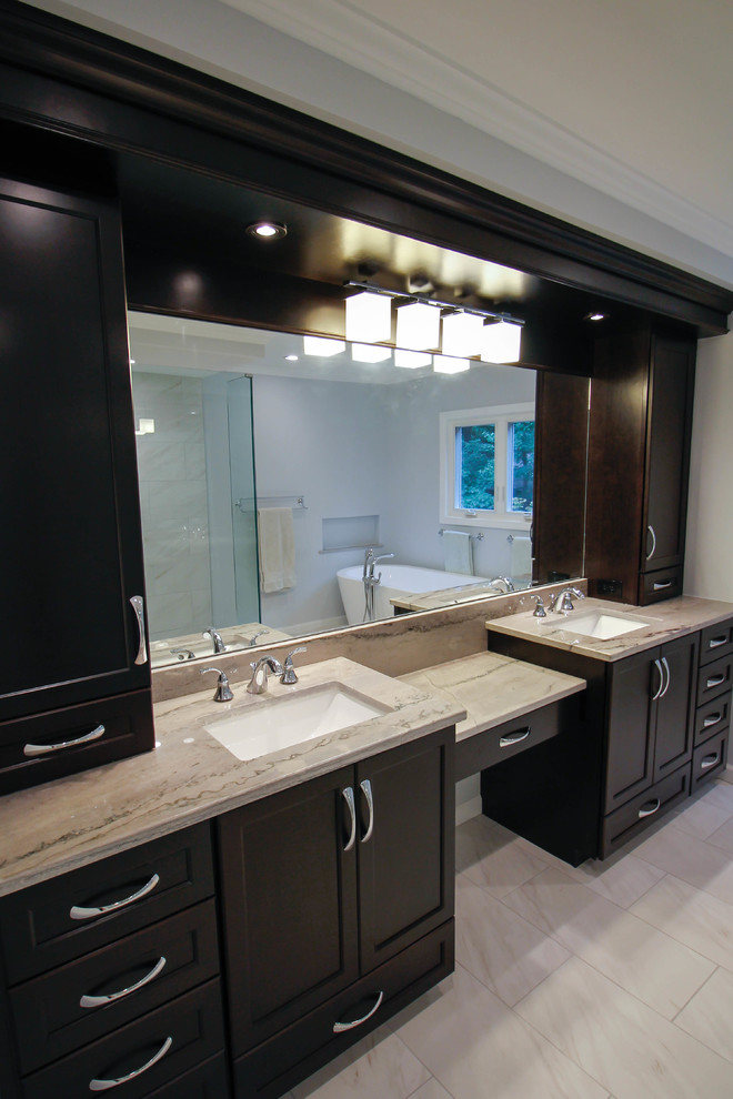 This is an example of a large contemporary master bathroom in New York with flat-panel cabinets, dark wood cabinets, a freestanding tub, a corner shower, a one-piece toilet, white tile, porcelain tile, blue walls, porcelain floors, an undermount sink, quartzite benchtops, white floor and an open shower.