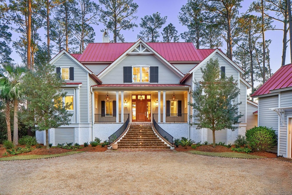 Design ideas for a large traditional three-storey grey exterior in Atlanta with wood siding and a gable roof.