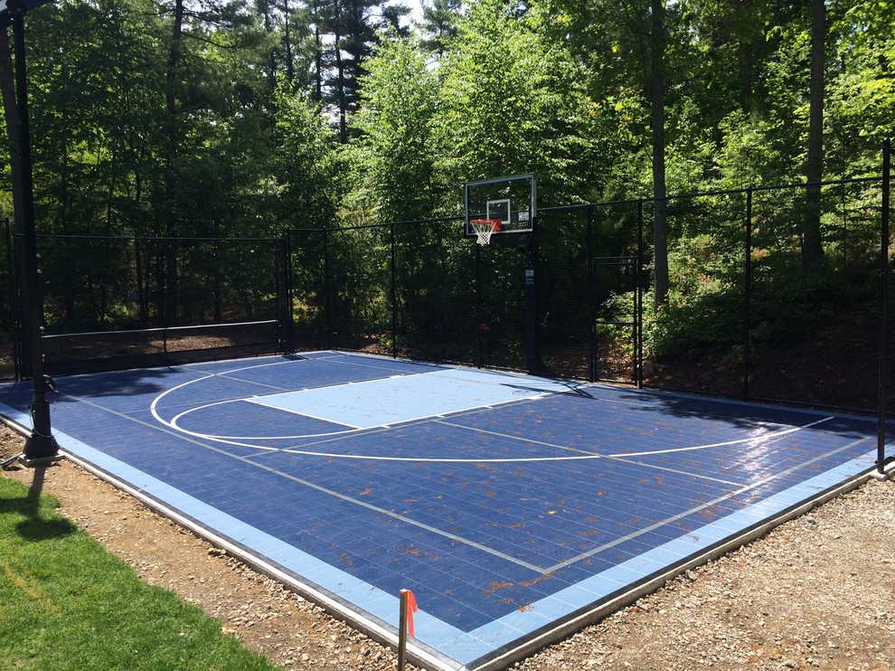 Inspiration for a mid-sized traditional backyard partial sun outdoor sport court in Boston with with outdoor playset and concrete pavers.