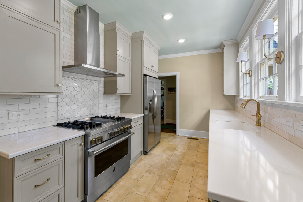 Inspiration for a small transitional galley porcelain tile and beige floor enclosed kitchen remodel in Birmingham with a single-bowl sink, recessed-panel cabinets, gray cabinets, quartz countertops, white backsplash, ceramic backsplash, stainless steel appliances, no island and white countertops