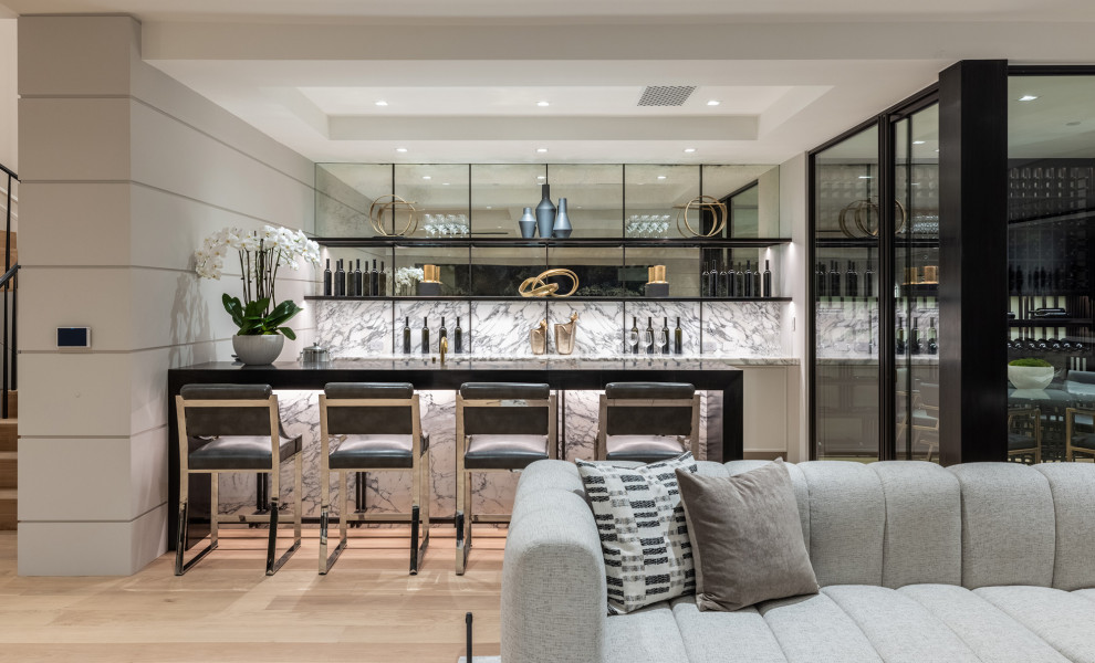 Inspiration for a mid-sized contemporary home bar in Los Angeles with light hardwood floors and beige floor.