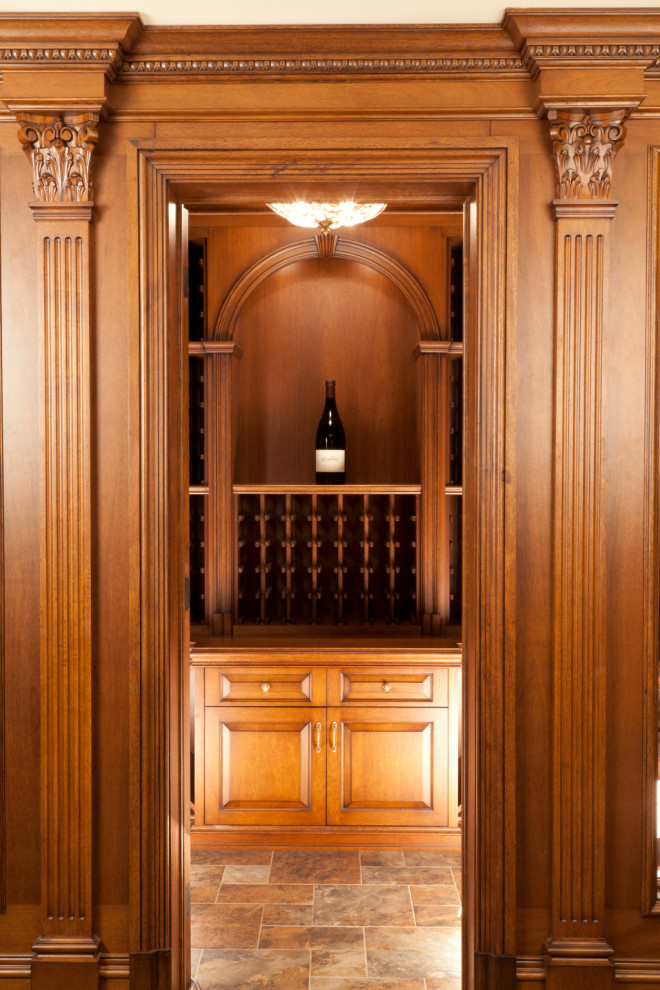 Design ideas for a small traditional wine cellar in New York with medium hardwood floors, storage racks and brown floor.